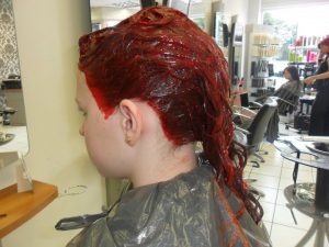 applying red colour to hair stage 4